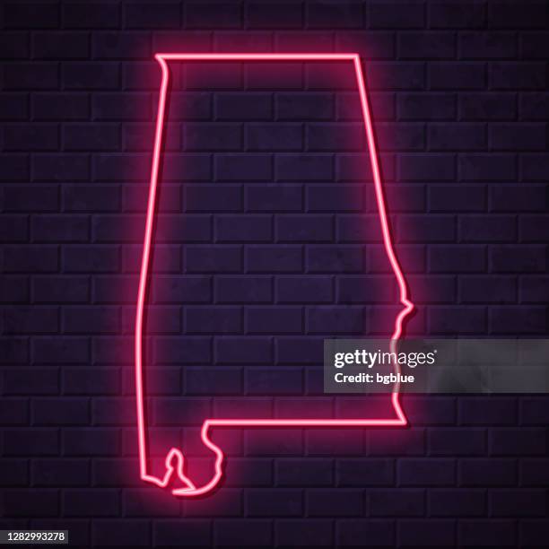 ilustrações de stock, clip art, desenhos animados e ícones de alabama map - glowing neon sign on brick wall background - alabama