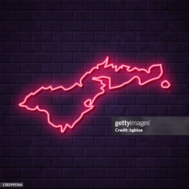 american samoa map - glowing neon sign on brick wall background - pago pago stock illustrations