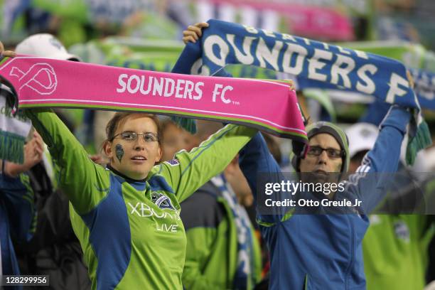 Fans cheer during the match between the Seattle Sounders FC and the Chicago Fire in the 2011 Lamar Hunt US Open Cup Final at CenturyLink Field on...