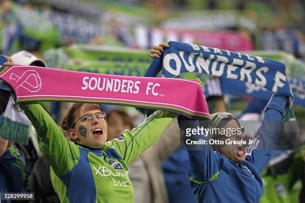 Fans cheer during the match between the Seattle Sounders FC and the Chicago Fire in the 2011 Lamar Hunt US Open Cup Final at CenturyLink Field on...