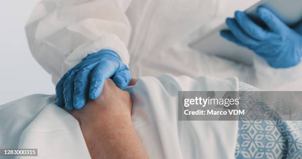 healing starts with a helpful hand - coronavirus patient stock pictures, royalty-free photos & images