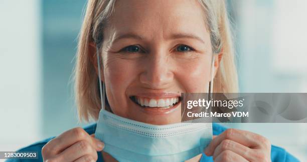 we can do this if we just keep positive - removing surgical mask stock pictures, royalty-free photos & images