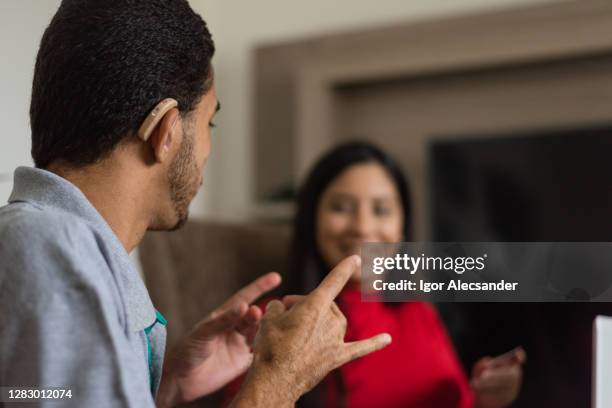 deaf talking in sign language - sign up imagens e fotografias de stock