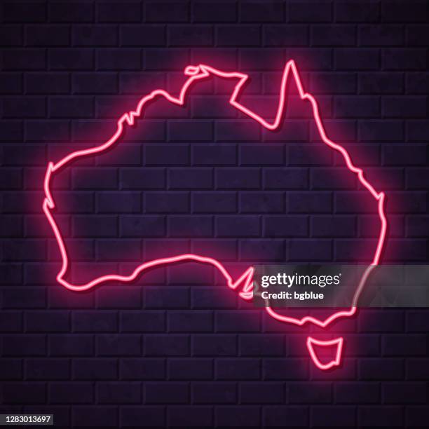 australia map - glowing neon sign on brick wall background - fluorescent stock illustrations
