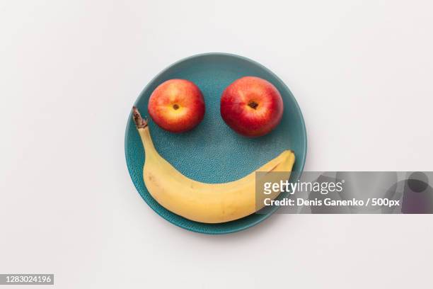 two apples and a banana create abstract smile,russia - banana ストックフォトと画像