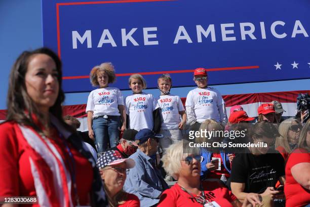 Children wearin 'Kids for Trump' shirts wait for the arrival of U.S. President Donald Trump during a campaign rally at Phoenix Goodyear Airport...