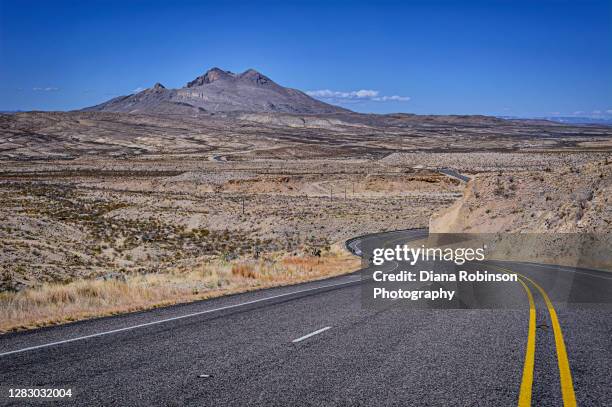 highway 118 heading towards the ghost town of terlingua, texas, usa - ghost town stockfoto's en -beelden