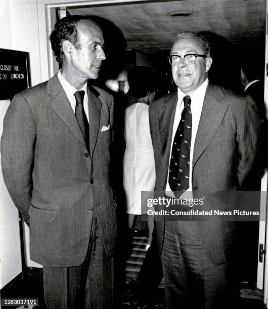 French Minister of the Economy and Finance Valery Giscard d'Estaing talks with US Secretary of the Treasury George P Shultz during an International...