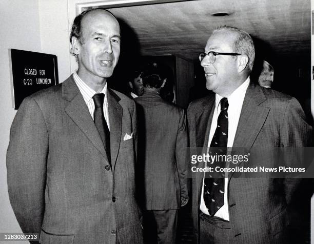 French Minister of the Economy and Finance Valery Giscard d'Estaing talks with US Secretary of the Treasury George P Shultz during an International...