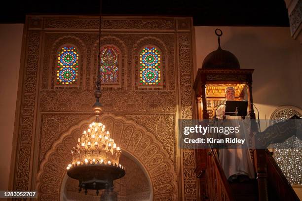 An Imam reads a poem ‘For the Republique’ as a homily to French Muslims in support of the laws of the French Republique during Friday prayers at the...