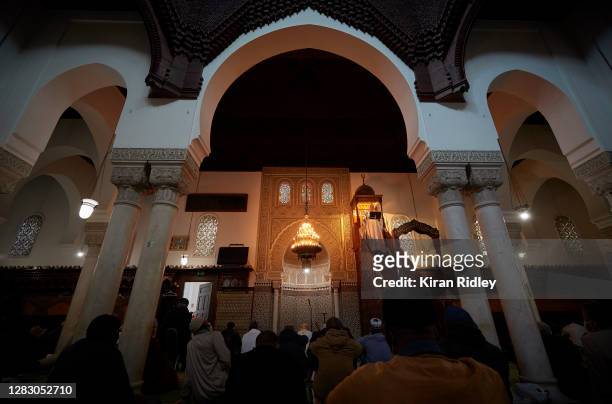 An Imam reads a poem ‘For the Republique’ as a homily to French Muslims in support of the laws of the French Republique during Friday prayers at the...