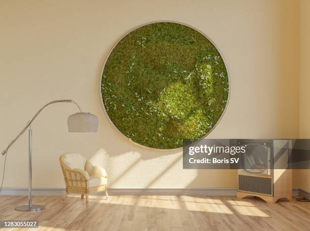 mid-century living room with moss wall - mos plant stockfoto's en -beelden