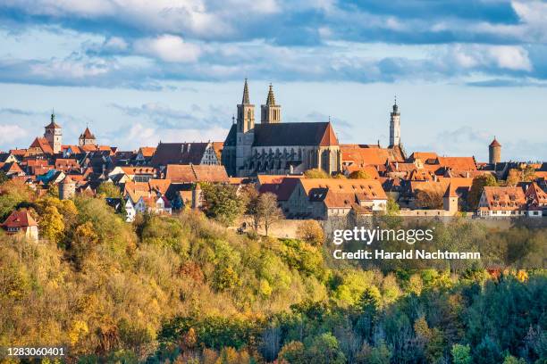 old town with trees in autumn colors, rothenburg ob der tauber, bavaria, germany - romantic road germany stock pictures, royalty-free photos & images