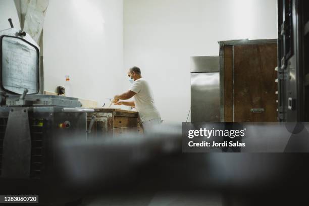 baker kneading bread dough - artisanal food and drink stock pictures, royalty-free photos & images