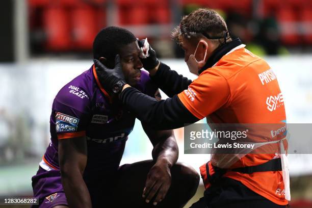 Jermaine McGillvary of Huddersfield Giants receives medical treatment during the Betfred Super League match between Warrington Wolves and...
