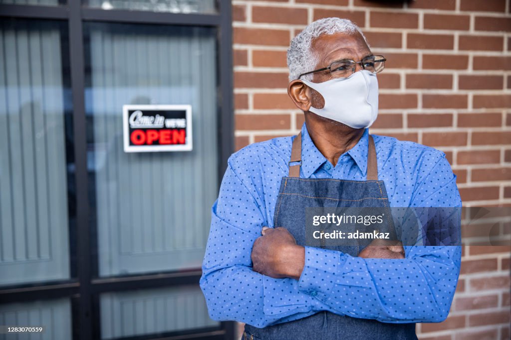 Senior Black Business Owner with Open Sign