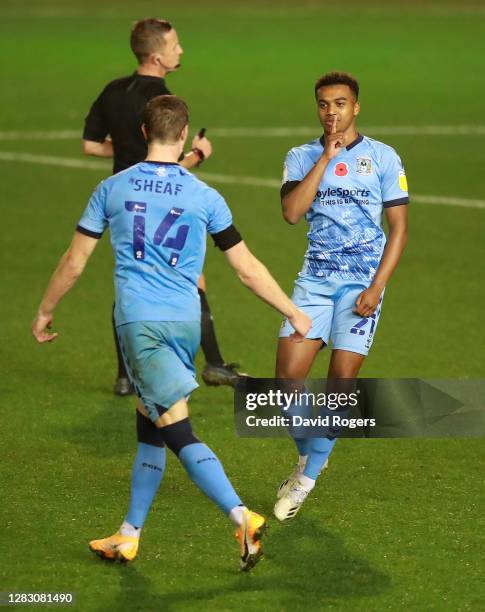 Sam McCallum of Coventry City celebrates with teammate Ben Sheaf after scoring his team's third goal during the Sky Bet Championship match between...