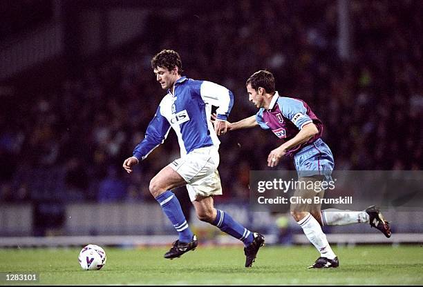 Chris Sutton of Blackburn Rovers is watched by Gareth Southgate of Aston Villa in the FA Carling Premiership match at Ewood Park in Blackburn,...