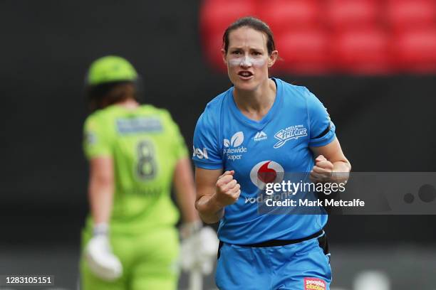 Megan Schutt of the Strikers celebrates taking the wicket of Tammy Beaumont of the Thunder during the Women's Big Bash League WBBL match between the...