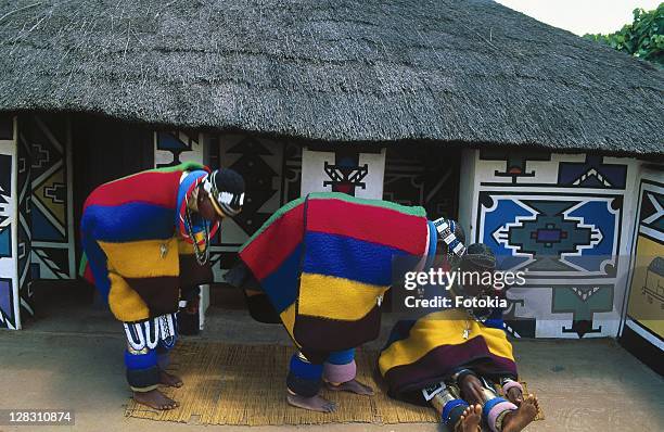 ndebele women in blankets and traditional jewelry - ndebele house stock pictures, royalty-free photos & images