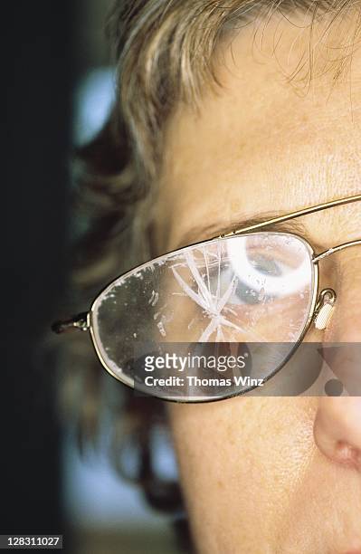 california, woman wearing smashed glasses - brille kaputt stock-fotos und bilder