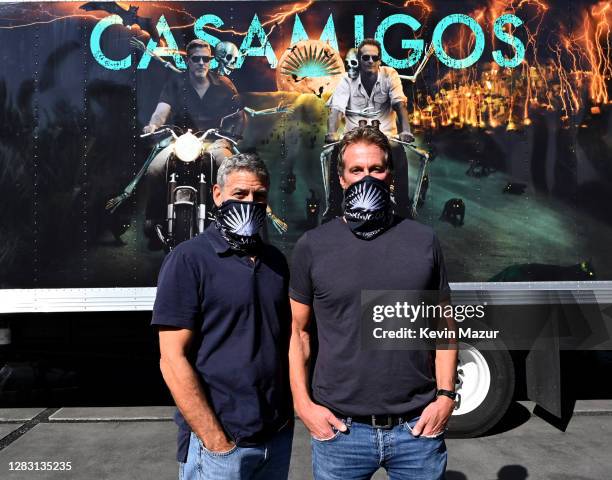 George Clooney and Rande Gerber prepare Casamigos Halloween Comes to You in Los Angeles, California.