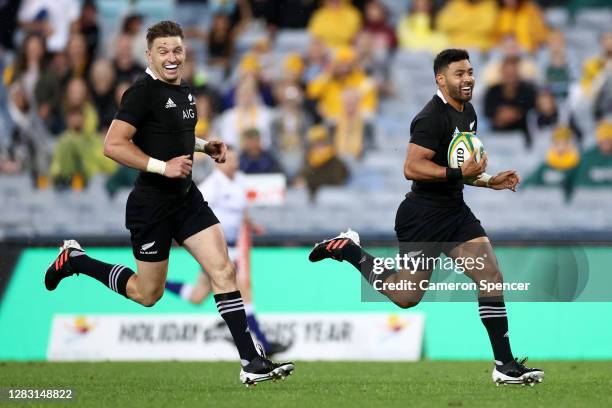 Beauden Barrett of the All Blacks celebrates as Richie Mo'unga of the All Blacks runs in to score his second try during the 2020 Tri-Nations and...