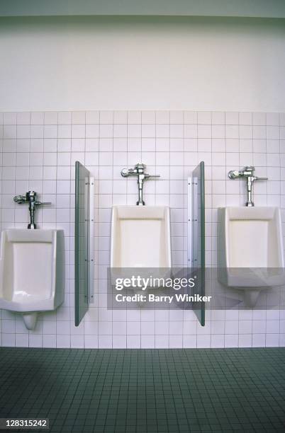 three urinals in mens bathroom - urinal stock pictures, royalty-free photos & images