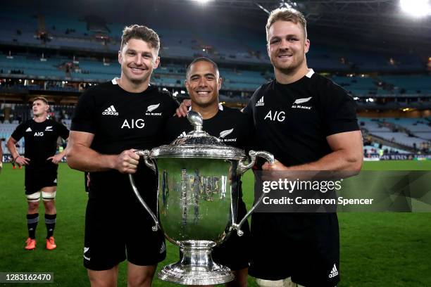 Beauden Barrett, Aaron Smith and Sam Cane of the All Blacks celebrate with the Bledisloe Cup after winning the 2020 Tri-Nations and Bledisloe Cup...