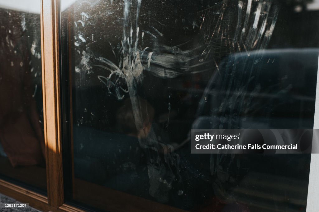 Children's Handprints on the inside of a Window