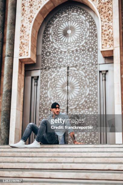 man sitting in casablanca - casablanca morocco stock pictures, royalty-free photos & images