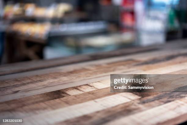 close-up of empty table - abandoned store stockfoto's en -beelden