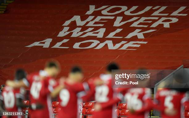 You'll Never Walk Alone banner is seen as Liverpool players observe a minutes silence in memory of former England player, Nobby Stiles MBE, as well...