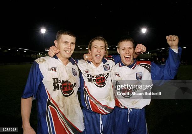 Colin West, Jon Brady and John Hamsher of Rushden and Diamonds celebrates winning the FA Cup round 2 Replay match against Doncaster at Nene Park,...