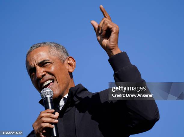Former U.S. President Barack Obama campaigns for Democratic presidential nominee Joe Biden at Northwestern High School on October 31, 2020 in Flint,...