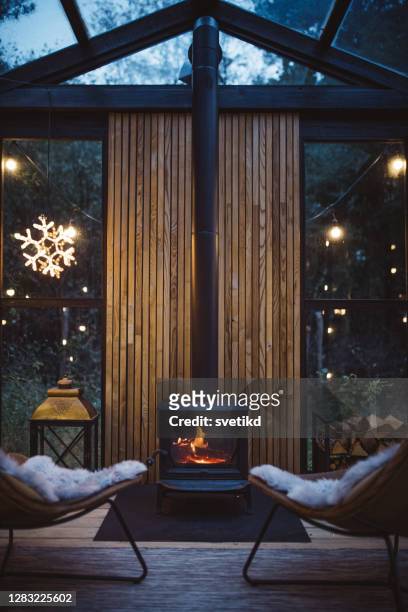 cozy place for rest - fireplace cosy stock pictures, royalty-free photos & images