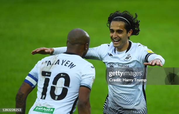 Andre Ayew of Swansea City celebrates after scoring his sides second goal with Yan Dhanda of Swansea City during the Sky Bet Championship match...