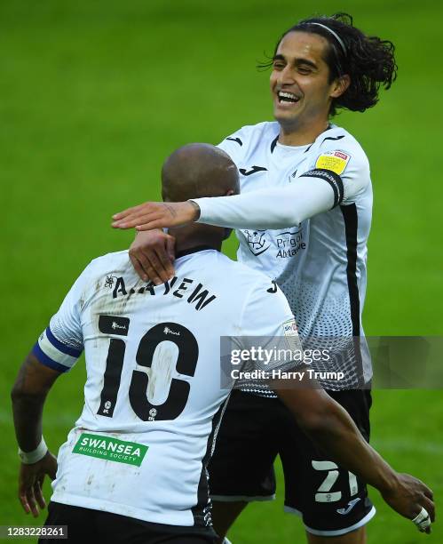 Andre Ayew of Swansea City celebrates after scoring his sides second goal with Yan Dhanda of Swansea City during the Sky Bet Championship match...