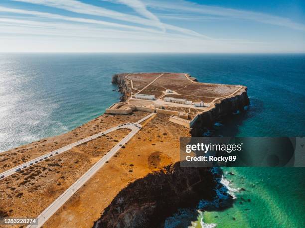 amazing drone shot of sagres fortress and church of our lady of grace, portugal - distrito de faro portugal imagens e fotografias de stock