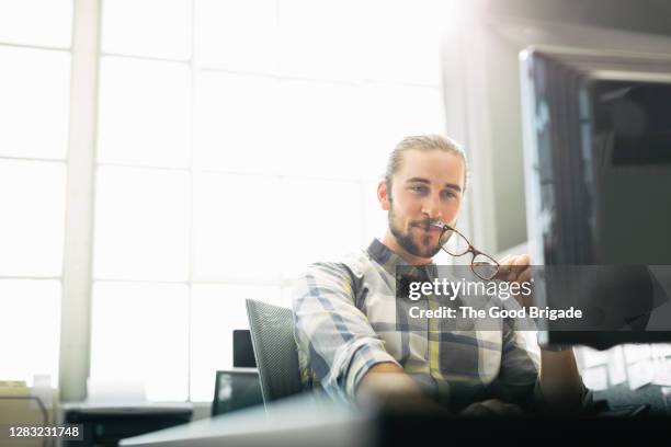 businessman working on desktop pc in office - confident desk man text space stock pictures, royalty-free photos & images