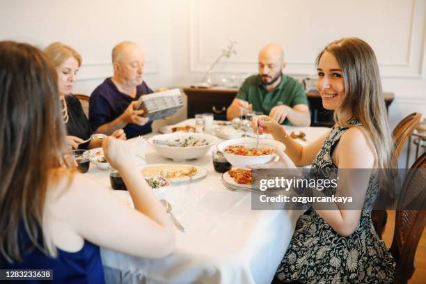 close up of friends having fun and toasting and celebrating with turkish rakı - turkish ethnicity stock pictures, royalty-free photos & images