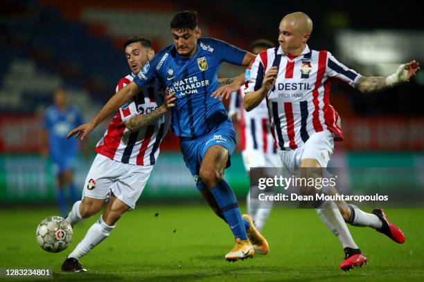 Armando Broja of Vitesse Arnhem battles for the ball with Sebastian Holmen and Pol Llonch of Willem II during the Dutch Eredivisie match between...