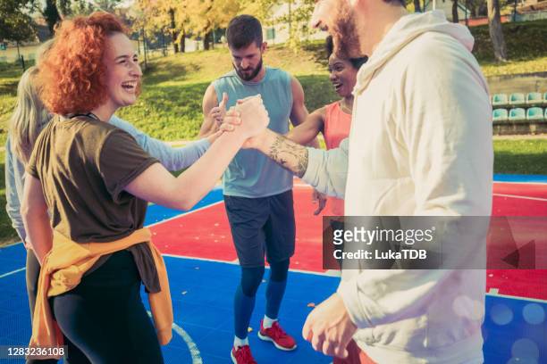 joint activation - sports team high five stock pictures, royalty-free photos & images