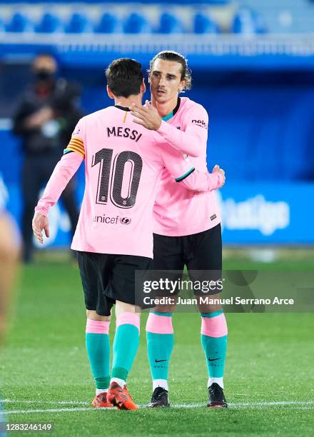 Antoine Griezmann of FC Barcelona celebrates with his teammate Lionel Messi of FC Barcelona after scoring the opening goal during the La Liga...