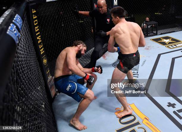 Alexander Hernandez drops Chris Gruetzemacher with a punch in a lightweight bout during the UFC Fight Night event at UFC APEX on October 31, 2020 in...