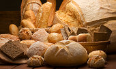 table decorated with various artisan breads produced with studio light.