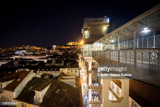 santa justa lift (elevador de santa justa) at dusk, lisbon, portugal - elevador de santa justa stock-fotos und bilder