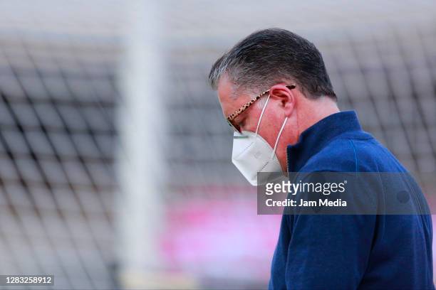 Ricardo Pelaez, sport director of Chivas walks while looking down prior to the 16th round match between Pumas UNAM and Chivas as part of the Torneo...