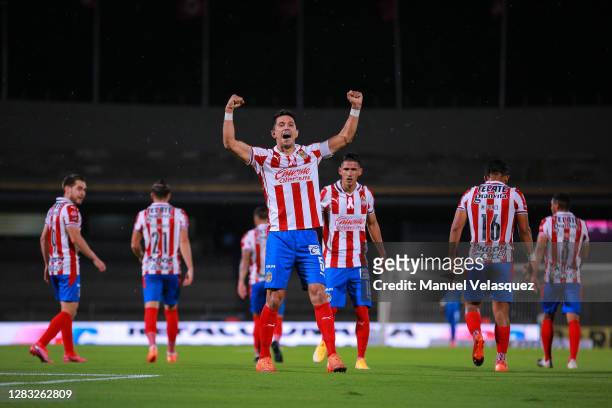 Jesús Molina of Chivas celebrates after scoring his team's second goal during the 16th round match between Pumas UNAM and Chivas as part of the...