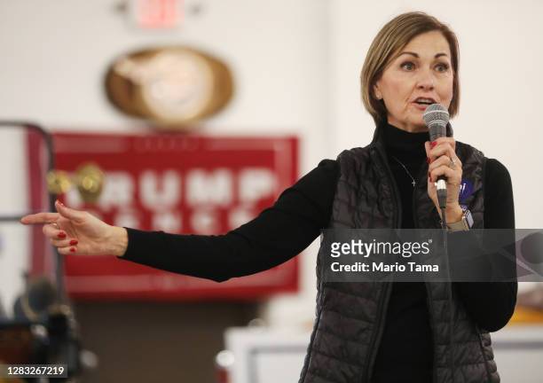 Iowa Gov. Kim Reynolds speaks at a campaign event for Senate candidate Sen. Joni Ernst at Dahl Auto Museum as part of Ernst's RV tour of Iowa on...